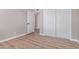 Bedroom with wood-look floors and door to hallway at 2633 W Ocotillo Rd # 3, Phoenix, AZ 85017