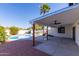 Covered patio overlooks refreshing pool and backyard at 2210 E Everett Dr, Phoenix, AZ 85022