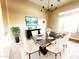 Modern dining room with a statement table and chairs at 42023 N Bridlewood Way, Phoenix, AZ 85086