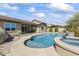 Stunning pool and spa area with outdoor kitchen and ample space at 2229 N Beverly Pl, Buckeye, AZ 85396