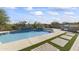 Stunning pool and patio area with a built-in BBQ and spa at 2229 N Beverly Pl, Buckeye, AZ 85396