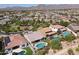 Aerial view of a luxury home community, showcasing homes with pools and mountain views at 2229 N Beverly Pl, Buckeye, AZ 85396
