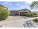 Two-story home with a gray two-car garage and paved driveway at 2229 N Beverly Pl, Buckeye, AZ 85396
