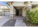 Front porch entryway with brick columns and a gray door at 2229 N Beverly Pl, Buckeye, AZ 85396
