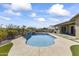 Resort style backyard with a large pool and artificial turf at 2229 N Beverly Pl, Buckeye, AZ 85396