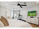 Main bedroom with large TV and access to backyard at 8320 E Appaloosa Trl, Scottsdale, AZ 85258