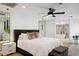 Spacious bedroom with a large bed and access to the bathroom at 8320 E Appaloosa Trl, Scottsdale, AZ 85258