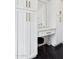 White vanity with black hexagon tile floor and gold fixtures at 8320 E Appaloosa Trl, Scottsdale, AZ 85258