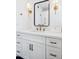 Modern bathroom with white cabinets, quartz countertop, and gold accents at 8320 E Appaloosa Trl, Scottsdale, AZ 85258