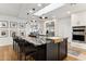 Modern kitchen island with black cabinets and marble countertop at 8320 E Appaloosa Trl, Scottsdale, AZ 85258