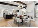 Modern dining area adjacent to kitchen with black and white decor at 8320 E Appaloosa Trl, Scottsdale, AZ 85258