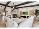 Open concept living space featuring a large sectional sofa and a flatscreen TV at 8320 E Appaloosa Trl, Scottsdale, AZ 85258