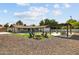 Spacious backyard with a pergola, fire pit, and artificial turf at 8320 E Appaloosa Trl, Scottsdale, AZ 85258