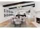 Elegant dining room with a black granite table and modern chandelier at 8320 E Appaloosa Trl, Scottsdale, AZ 85258