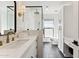 Modern bathroom with white vanity, hexagon tile floor, and glass shower at 8320 E Appaloosa Trl, Scottsdale, AZ 85258