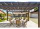 Outdoor patio with seating area and pergola overlooking the pool at 8320 E Appaloosa Trl, Scottsdale, AZ 85258