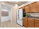 Kitchen with white appliances and wood cabinets at 16308 E Arrow Dr # 111, Fountain Hills, AZ 85268
