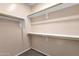 Walk-in closet with double hanging rods at 16308 E Arrow Dr # 111, Fountain Hills, AZ 85268