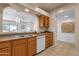 Kitchen with wood cabinets, double sink and dishwasher at 16308 E Arrow Dr # 111, Fountain Hills, AZ 85268