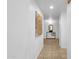 Hallway with artwork and a console table at 16308 E Arrow Dr # 111, Fountain Hills, AZ 85268