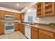 Kitchen with wood cabinets and modern appliances at 16308 E Arrow Dr # 111, Fountain Hills, AZ 85268