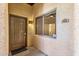 Condo entrance with a brown door and window at 16308 E Arrow Dr # 111, Fountain Hills, AZ 85268