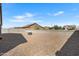 Backyard with gravel, block wall, and fire pit at 530 W Pintail Dr, Casa Grande, AZ 85122