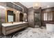 Modern bathroom with double vanity, large walk-in shower, and freestanding soaking tub at 14828 N 15Th Ave, Phoenix, AZ 85023
