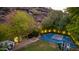 Elevated view of backyard with basketball court, playground, and patio area at 14828 N 15Th Ave, Phoenix, AZ 85023