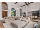Open living area with hardwood floors, comfortable seating, and a view into the dining area at 14828 N 15Th Ave, Phoenix, AZ 85023
