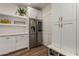 Laundry room with modern appliances and white cabinetry at 14828 N 15Th Ave, Phoenix, AZ 85023