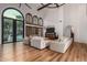 Open living area with hardwood floors, comfortable seating and a view of the backyard at 14828 N 15Th Ave, Phoenix, AZ 85023