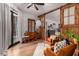 Relaxing sitting area with comfortable armchairs and sliding barn doors at 14828 N 15Th Ave, Phoenix, AZ 85023