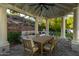 Covered patio with dining table and seating area at 14828 N 15Th Ave, Phoenix, AZ 85023