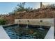 Serene koi pond with cascading water feature at 14828 N 15Th Ave, Phoenix, AZ 85023