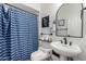 Clean bathroom with a white sink and bathtub at 14828 N 15Th Ave, Phoenix, AZ 85023