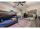 Bedroom with bunk beds, dresser, and mirrored closet at 14828 N 15Th Ave, Phoenix, AZ 85023