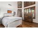 Bright bedroom with a comfortable bed, dresser, and large windows with plantation shutters at 14828 N 15Th Ave, Phoenix, AZ 85023