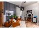 Functional home office space with a desk, chairs, and ample natural light at 14828 N 15Th Ave, Phoenix, AZ 85023