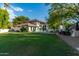 Spacious backyard with pool, patio, and grassy area at 14828 N 15Th Ave, Phoenix, AZ 85023