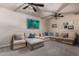 Spacious Gathering room features a large sectional sofa and ceiling fan at 14828 N 15Th Ave, Phoenix, AZ 85023