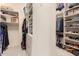 Large walk-in closet with ample shelving and hanging space at 37295 N Boulder View Dr, Scottsdale, AZ 85262