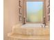 Relax in this luxurious bathroom, featuring a large soaking tub and tile flooring at 37295 N Boulder View Dr, Scottsdale, AZ 85262