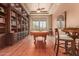 Game room features a pool table, built-in shelving, and hardwood floors at 37295 N Boulder View Dr, Scottsdale, AZ 85262