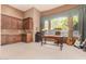Home office with built-in cabinetry and plenty of natural light at 37295 N Boulder View Dr, Scottsdale, AZ 85262
