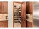 Well-organized pantry with ample shelving for storage at 37295 N Boulder View Dr, Scottsdale, AZ 85262