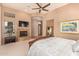 Main bedroom with fireplace, TV, and ample space at 37295 N Boulder View Dr, Scottsdale, AZ 85262