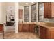 Convenient wet bar with wine cooler and granite countertops at 37295 N Boulder View Dr, Scottsdale, AZ 85262