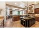 Open concept kitchen with large island and views into the dining area at 37295 N Boulder View Dr, Scottsdale, AZ 85262
