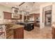 Spacious kitchen with large island, high-end appliances, and wood cabinetry at 37295 N Boulder View Dr, Scottsdale, AZ 85262
